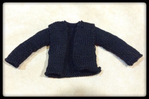 A knit jacket made for an Ood doll